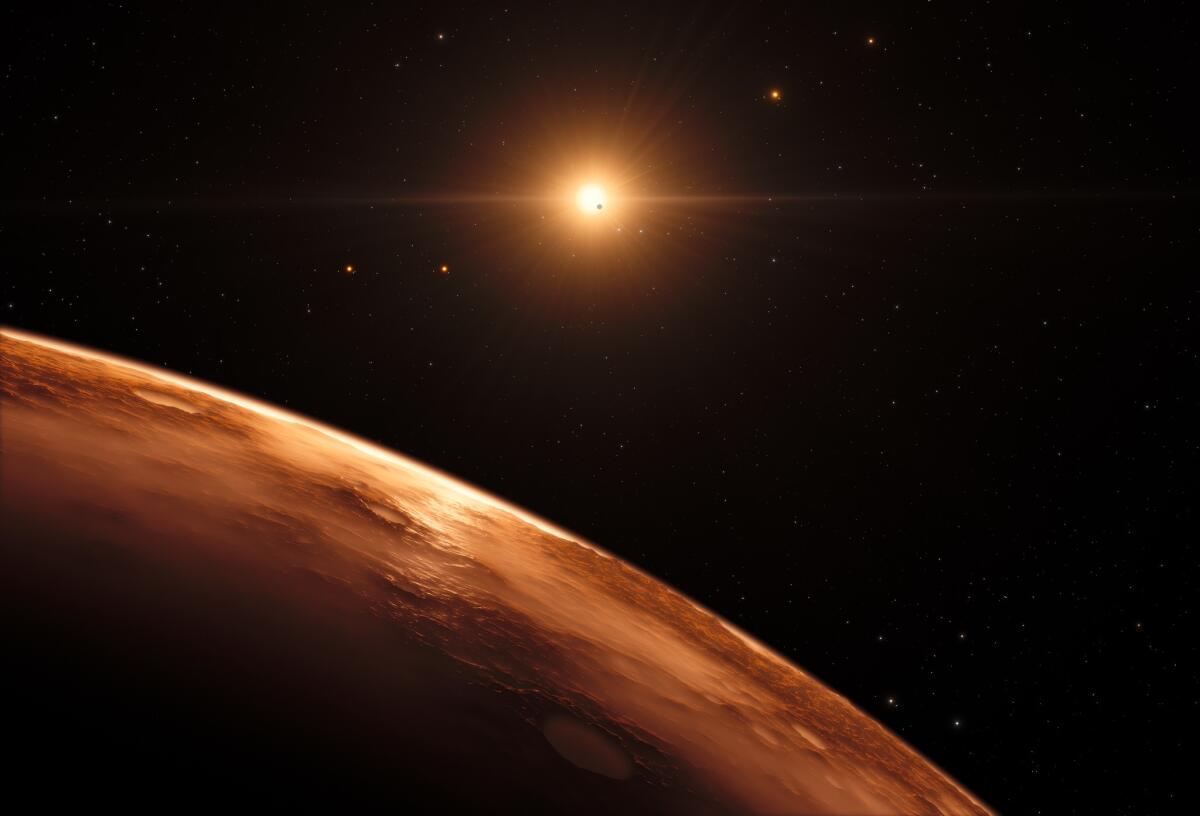 An artist's impression shows the view just above the surface of one of the planets in the TRAPPIST-1 system. At least seven planets orbit this ultracool dwarf star 40 light-years from Earth, and they are all roughly the same size as the Earth. (M. Kornmesser / European Southern Observatory / spaceengine.org)