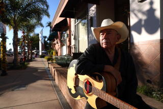 A man with a guitar.