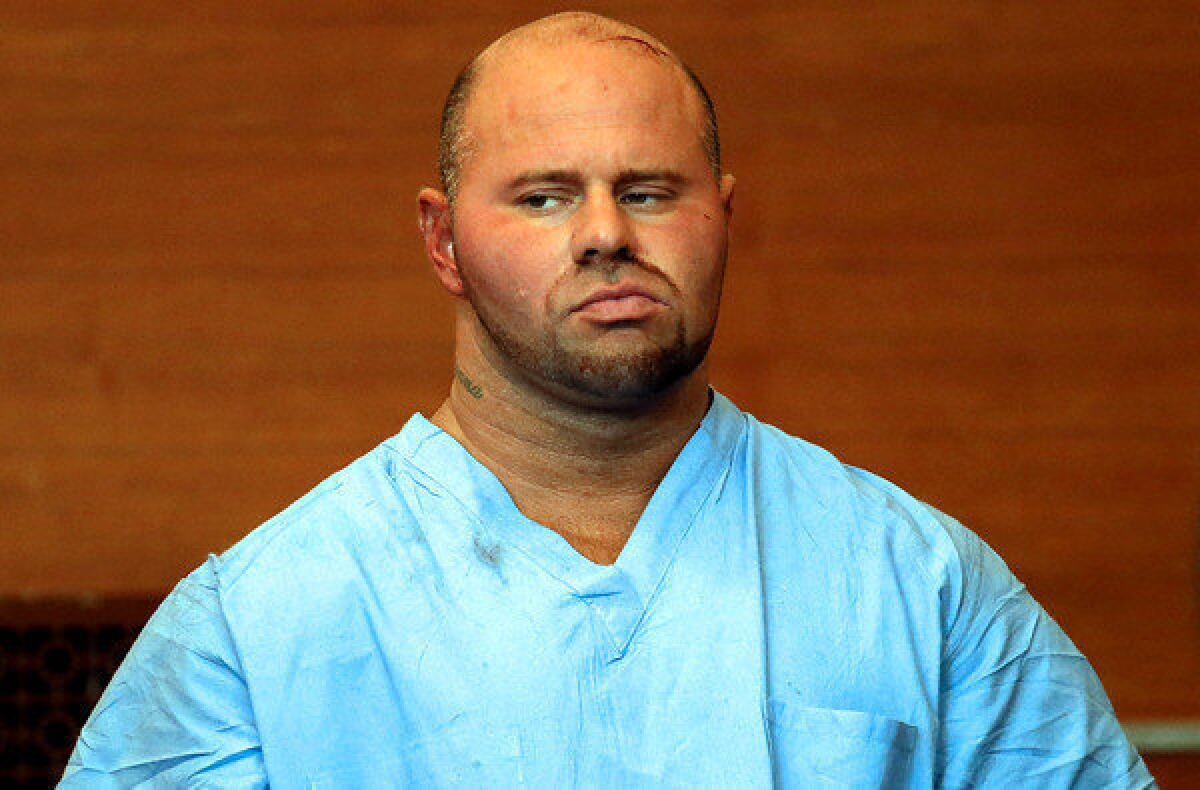 Jared Remy appears at Waltham District Court for his arraignment on Friday, when he pleaded not guilty to a charge of murder in the stabbing death of girlfriend Jennifer Martel.