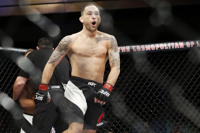 Frankie Edgar celebrates after defeating Chad Mendes.