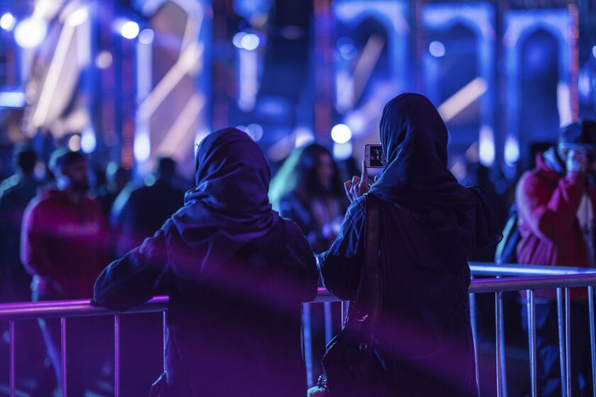 In this Friday Dec. 20, 2019 photo, people attend a concert, part of the MDL Beast Festival, a three-day musical extravaganza in Riyadh, Saudi Arabia. The festival was the kingdom's most eye-popping effort yet at showcasing the dramatic changes taking hold in this country, where more than half of the 20 million citizens are below the age of 25. While the social changes ushered in by Crown Prince Mohammed bin Salman have been sweeping, so too is his crackdown on criticism and political expression. (MDL Beast via AP)