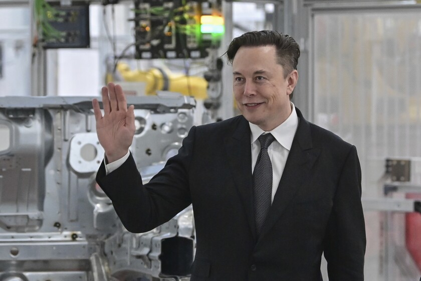 FILE - Tesla CEO Elon Musk attends the opening of the Tesla factory Berlin Brandenburg in Gruenheide, Germany, Tuesday, March 22, 2022. Musk has used Twitter to announce he had met with Pope Francis. Musk used the @Pontifex handle in tweeting that he was “honored” to meet with Francis on Friday, July 1, 2022. (Patrick Pleul/Pool via AP, File)