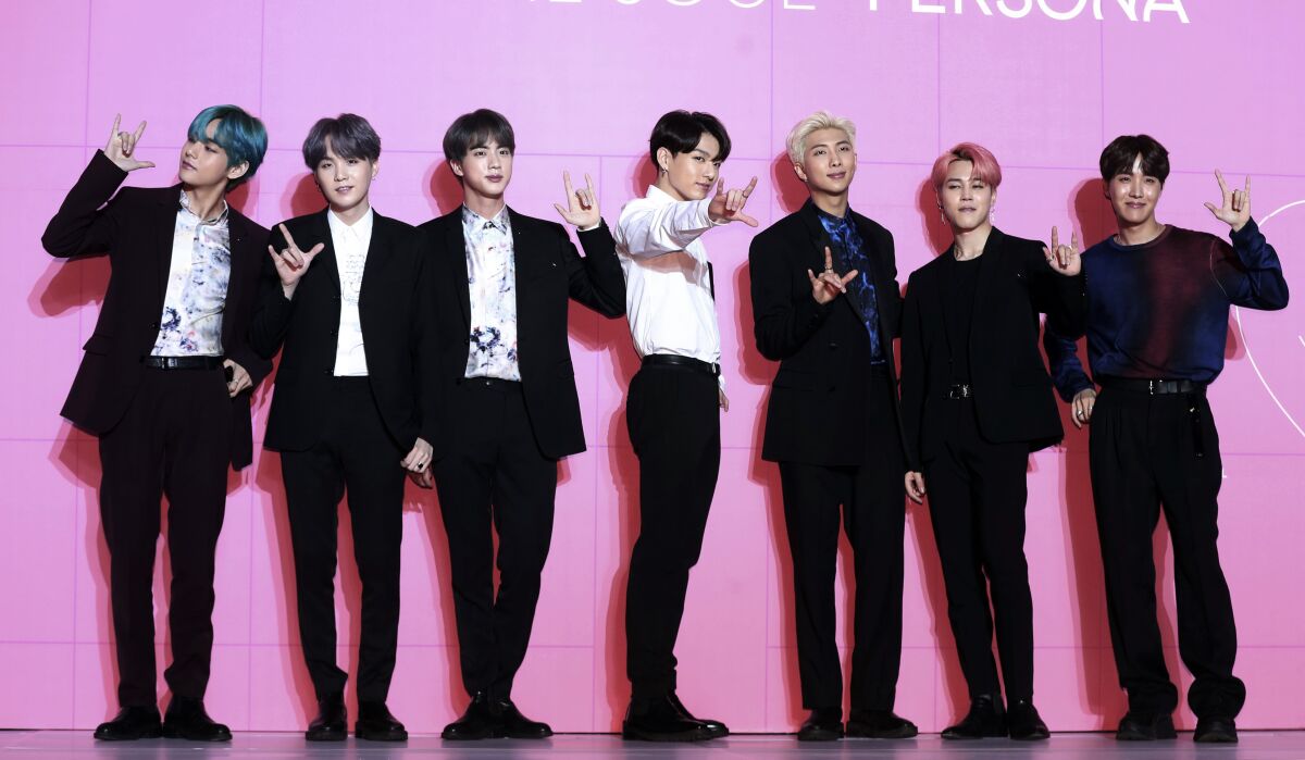 FILE - Members of South Korean K-Pop group BTS appear during a press conference in Seoul, South Korea.
