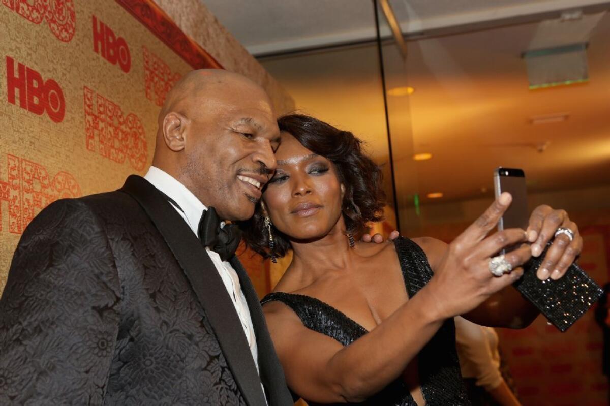 Angela Bassett snaps the photo everyone seemed to be after Sunday night -- a pic with former heavyweight champ Mike Tyson.