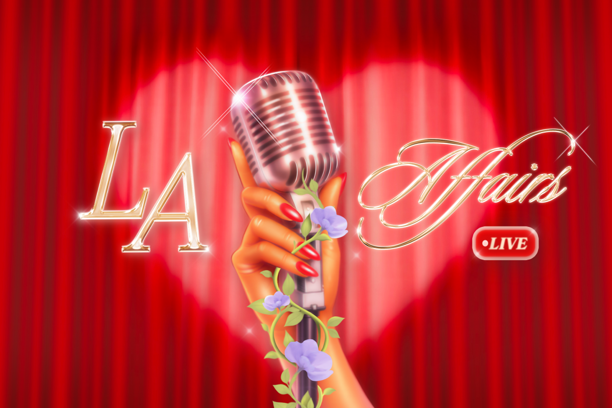 Hand holding a microphone with flowers growing on it.