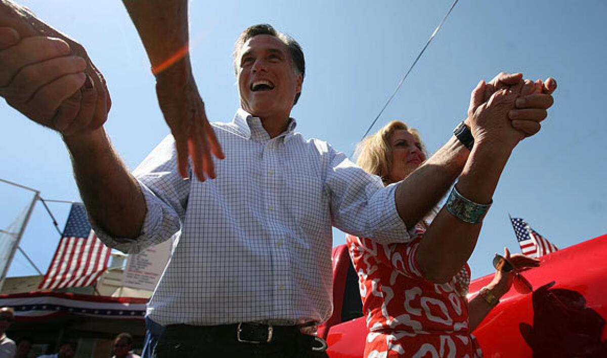 Mitt Romney, former Massachusetts governor and a Republican candidate in the 2012 presidential election, campaigns in Salt Lake City.