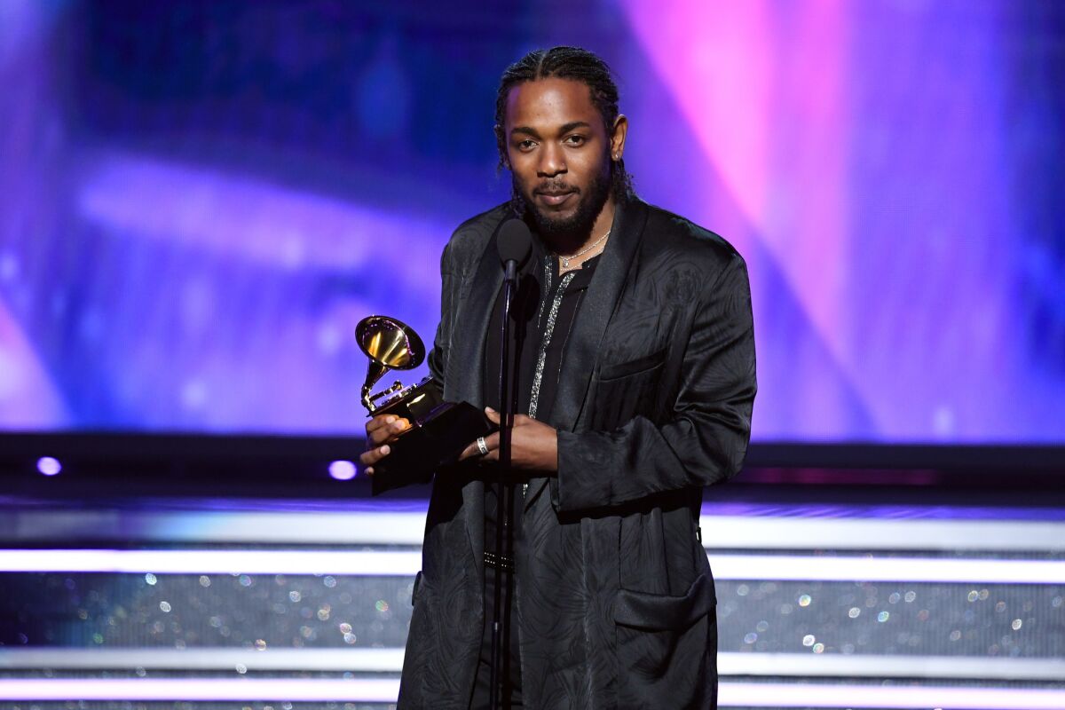 Kendrick Lamar accepts the best rap album Grammy for "Damn."