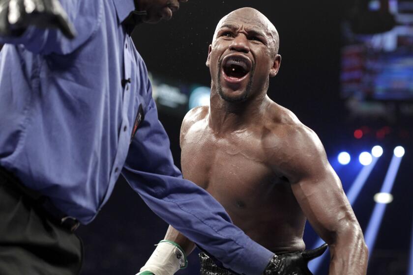 Floyd Mayweather Jr. reacts during a bout against Marcos Maidana on Sept. 13 in Las Vegas. Mayweather won by unanimous decision.