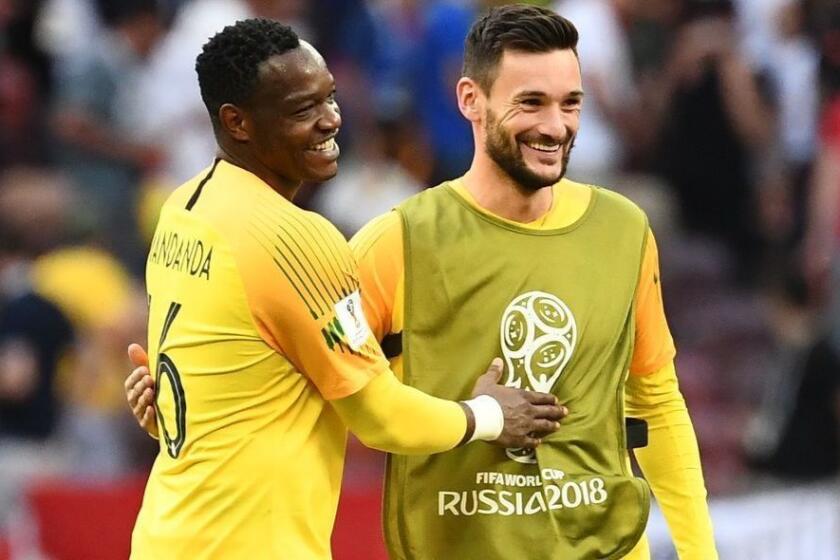 France's goalkeeper Hugo Lloris (R) congratulates France's goalkeeper Steve Mandanda at the end of the Russia 2018 World Cup Group C football match between Denmark and France at the Luzhniki Stadium in Moscow on June 26, 2018. / AFP PHOTO / FRANCK FIFE / RESTRICTED TO EDITORIAL USE - NO MOBILE PUSH ALERTS/DOWNLOADSFRANCK FIFE/AFP/Getty Images ** OUTS - ELSENT, FPG, CM - OUTS * NM, PH, VA if sourced by CT, LA or MoD **