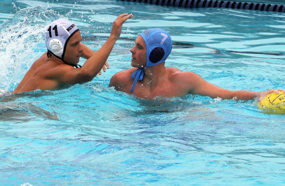 Newport Harbor's Ty Hansberger (11) guards CdM's Luke Zimmerman (7) during the rivals' game on Saturday.