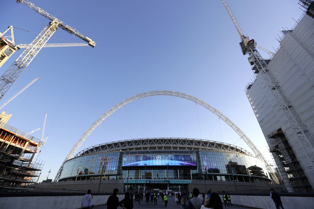FILE - A view of the exterior of Wembley Stadium in London, Wednesday, Oct. 3, 2018. Doubts and disputes over FIFA's future program for the World Cup contributed to Britain and Ireland dropping plans on Monday, Feb. 7, 2022 for a joint bid to host the 2030 edition, opting instead to try to stage the 2028 European Championship. (AP Photo/Kirsty Wigglesworth, FILE)