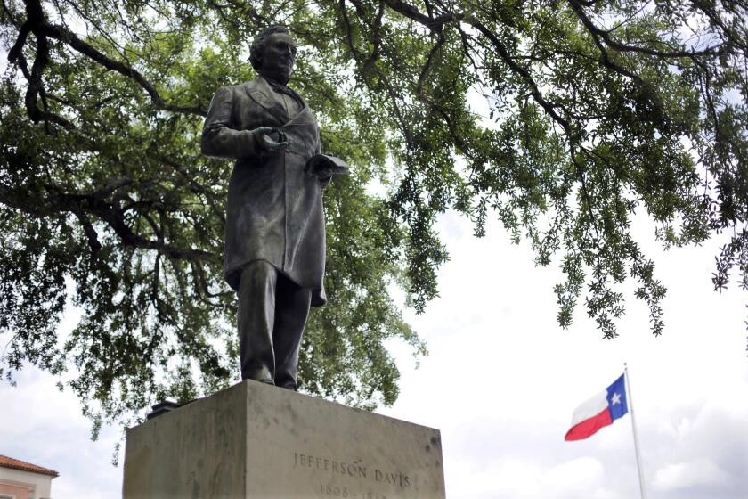 This statue of Jefferson Davis, which has stood at the center of the University of Texas campus for years, is being moved to a lower-profile spot. Staues of other Confederate leaders, however, will stay.