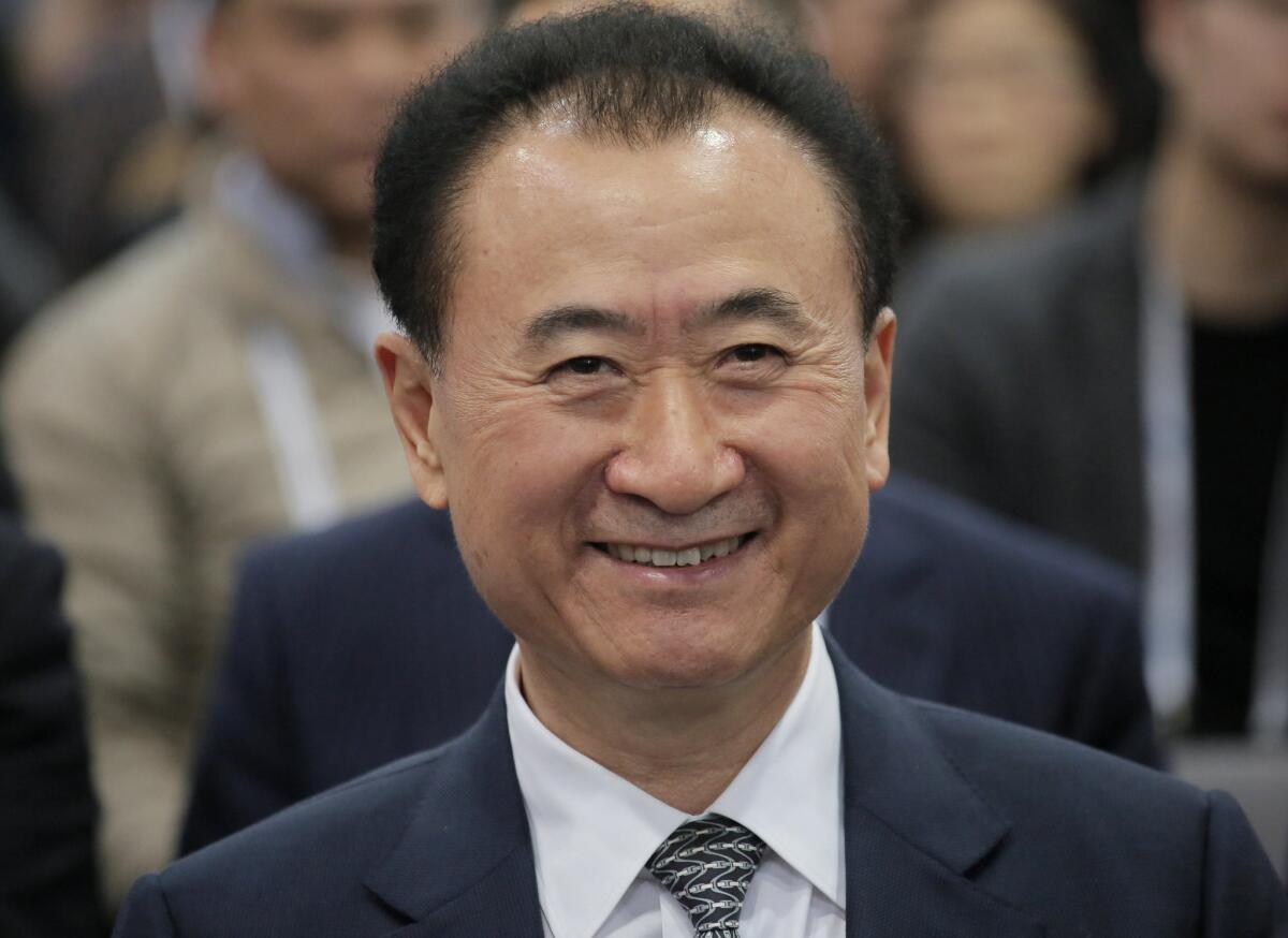 Wang Jianlin, chairman of Wanda Group, smiles at the Ninth Asian Financial Forum in Hong Kong, Monday, Jan. 18, 2016. (AP Photo/Vincent Yu)