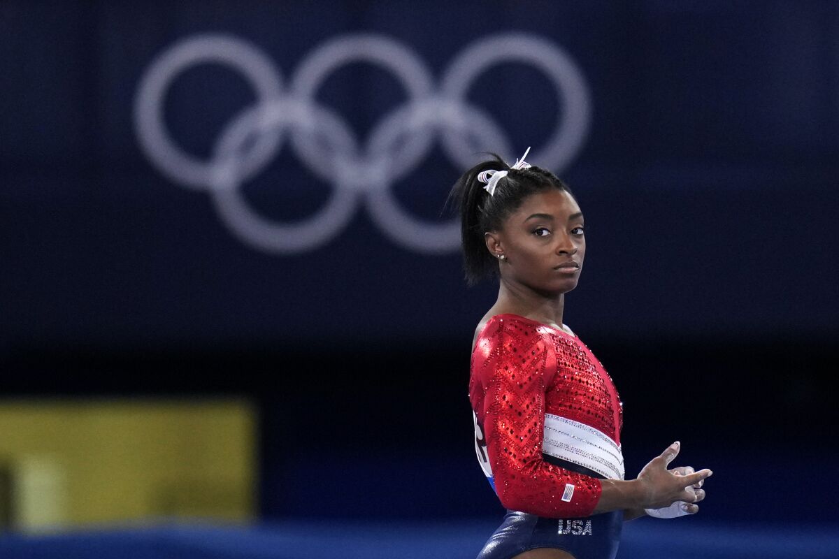 U.S. gymnast Simone Biles looks on during the women's team competition at the Olympics on Tuesday.