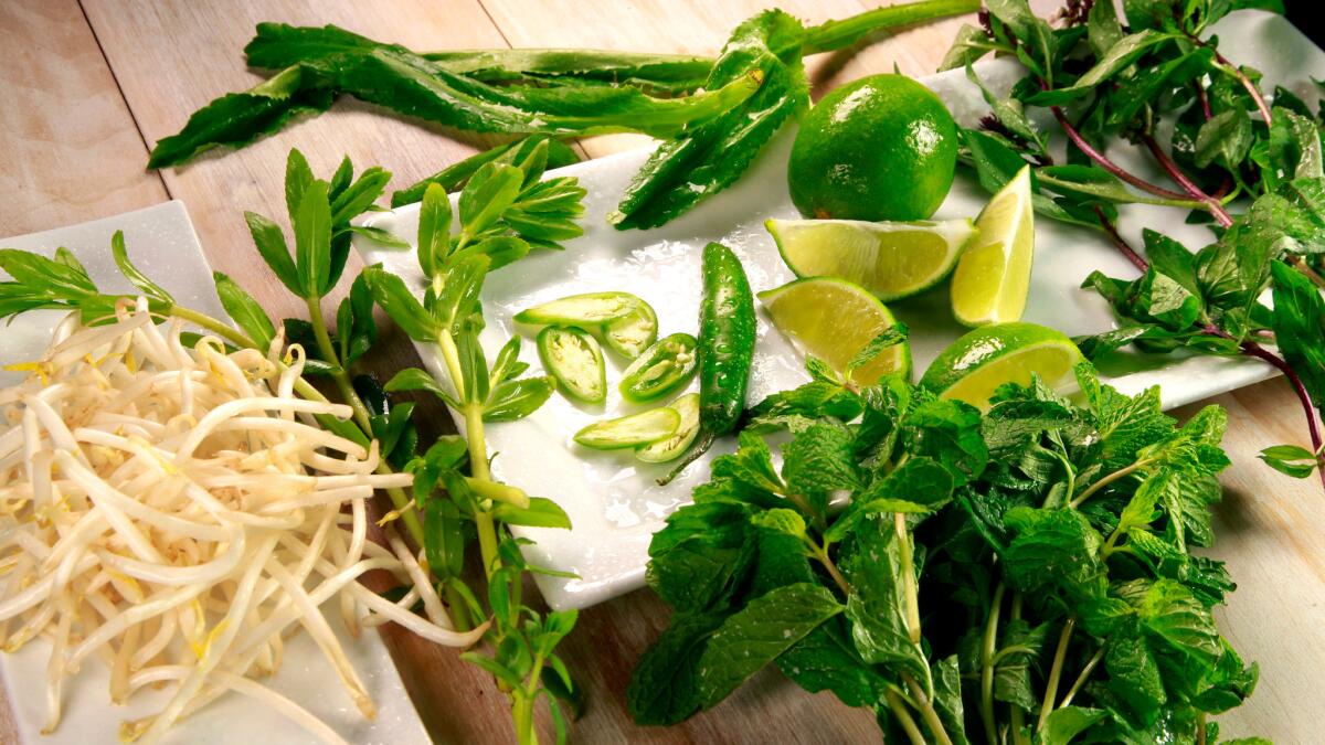 Pho garnishes include bean sprouts, mint leaves, lime and Thai chiles.