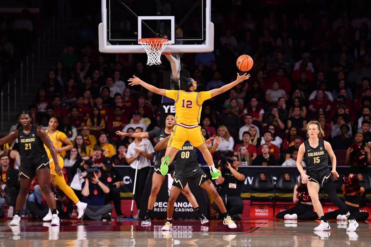 USC guard JuJu Watkins tries to hang on to the ball during a win over Colorado on Friday.