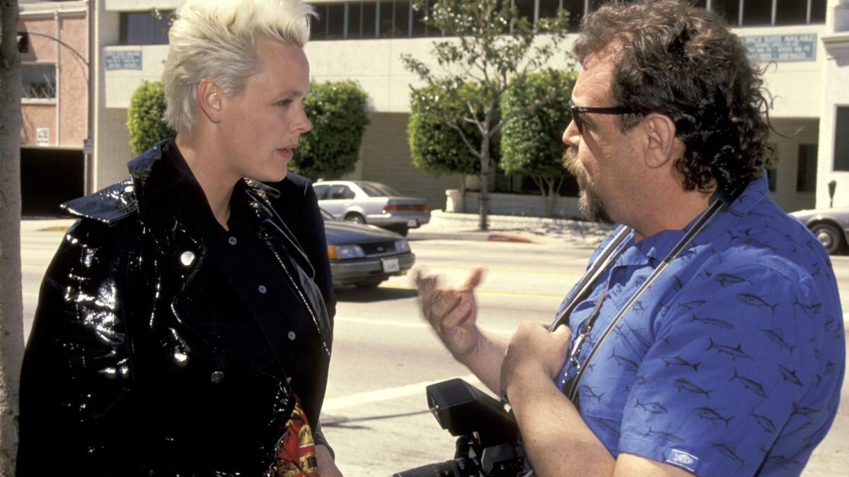 Actress and model Brigitte Nielsen and E.L. Woody exchange pleasantries outside Le Dome Restaurant, where the celebrity photographer spotted her in 1991.