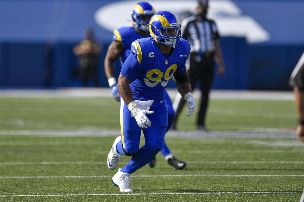 Rams defensive tackle Aaron Donald runs on the field.