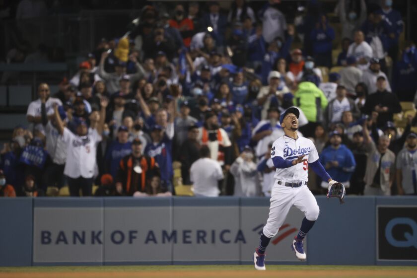 Los Angeles, CA - October 12: Los Angeles Dodgers right fielder Mookie Betts calls for a pop fly by San Francisco Giants' Donovan Solano to end game four of the 2021 National League Division Series at Dodger Stadium on Tuesday, Oct. 12, 2021 in Los Angeles, CA. (Robert Gauthier / Los Angeles Times)