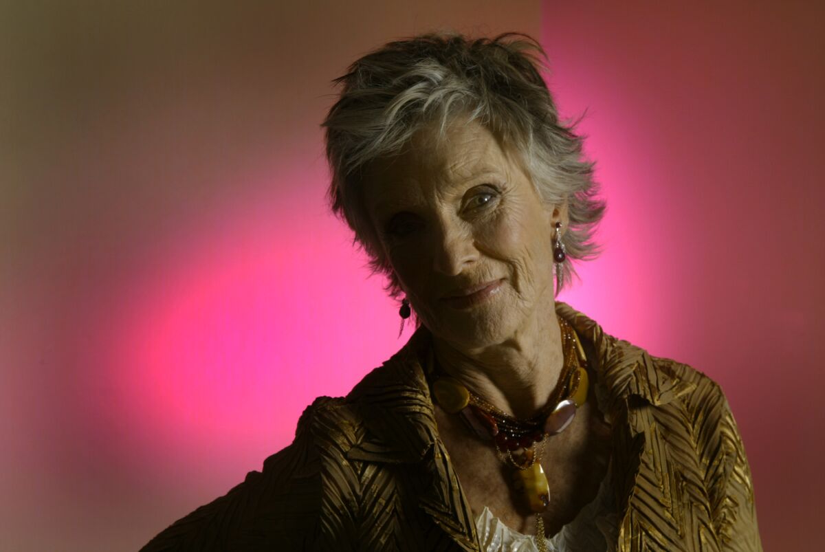 Cloris Leachman photographed in front of a pink background in 2004.