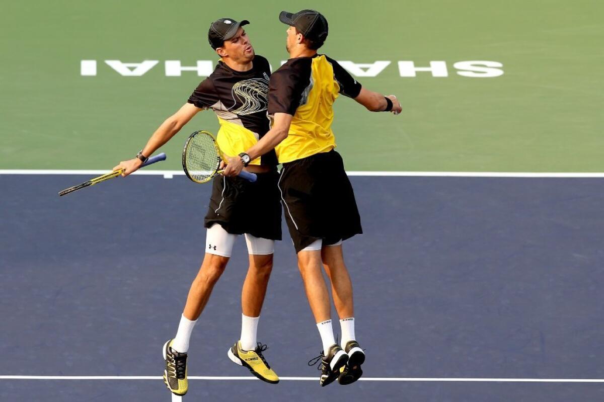 Bob Bryan, left, and Mike Bryan celebrate match point against Treat Huey of the Philippines and Dominic Inglot of Great Britain during the Shanghai Rolex Masters on Oct. 11.