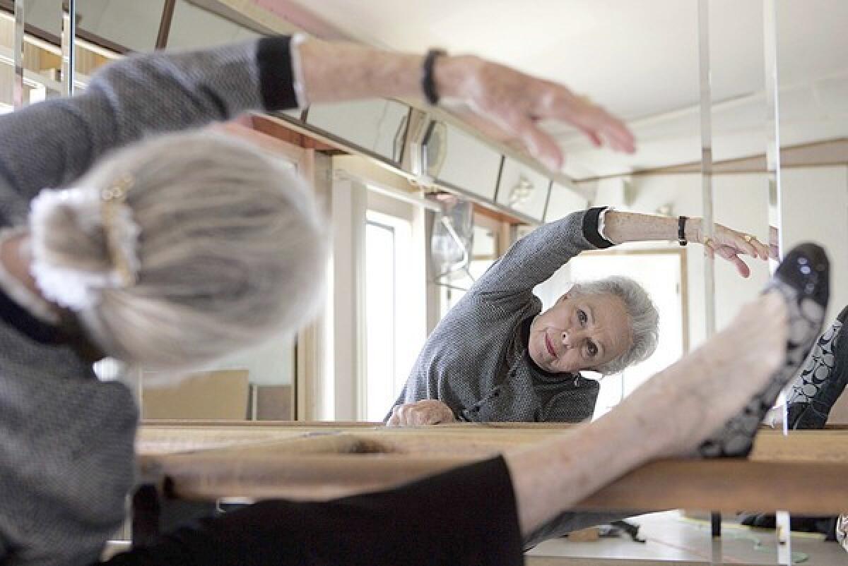 Marge Champion limbering up at the barre in 2009.