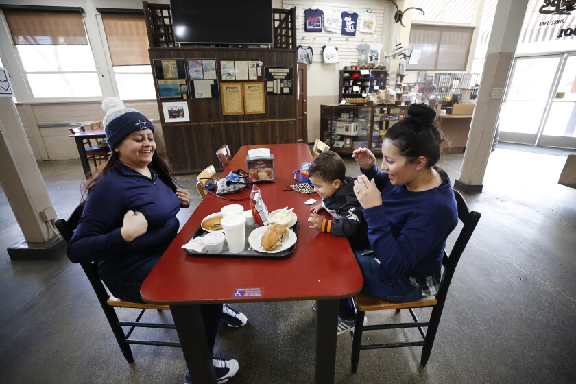 Lori Joaquin, with her 2-year-old son Zac Joaquin, and sister Robyn Vasquez eat lunch at Philippe The Original
