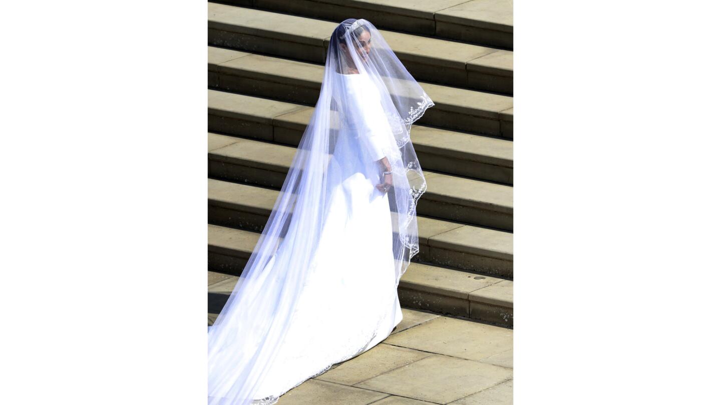 Clare Waight Keller is the master British designer behind the silk boat-necked gown and long veil worn by Meghan Markle as she walked down the flower-bedecked nave of St. George's Chapel for her wedding to Prince Harry.