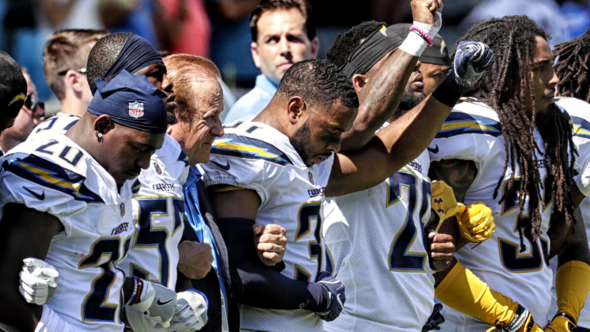 Chargers players have agreed to simply lock arms in unity this week during the playing of the national anthem.