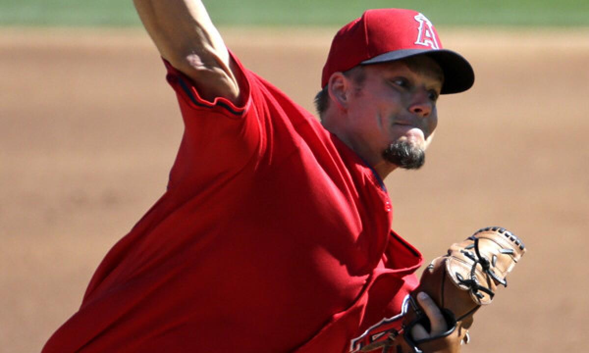 Angels starter Joe Blanton delivers a pitch during a Cactus League game against the Colorado Rockies on March 7. Does Blanton have any chance of making the Angels' opening-day roster?