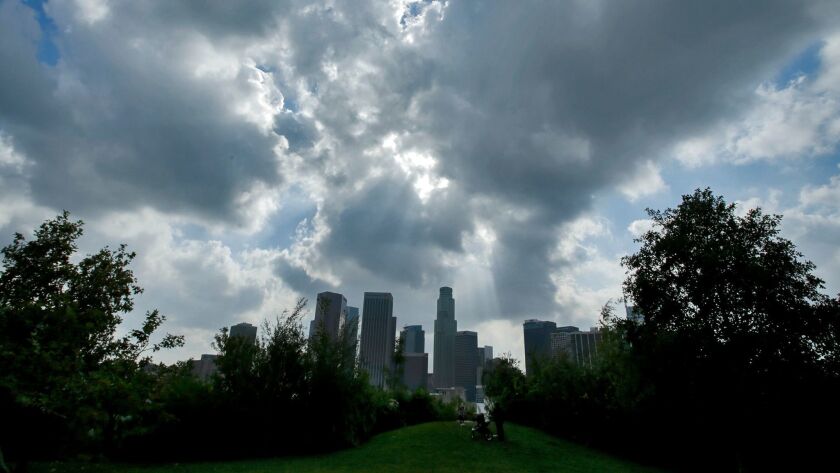 Clouds loom over Los Angeles in November 2016. The L.A. area is expected to see about half an inch of rain, starting Tuesday night, the National Weather Service says.