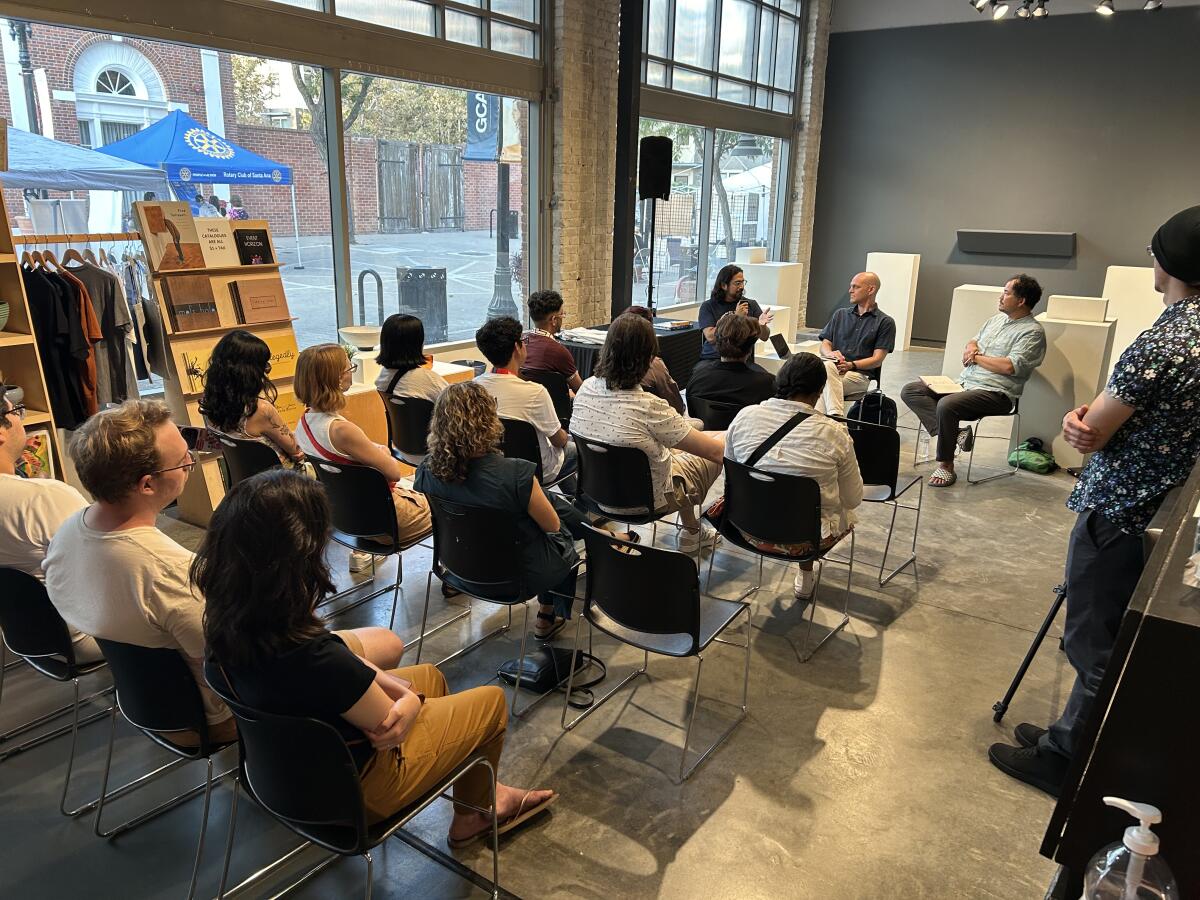 Manny Escamilla, Daniel Tucker and Rosten Woo discuss the creation of the time capsule at Grand Central Art Center.