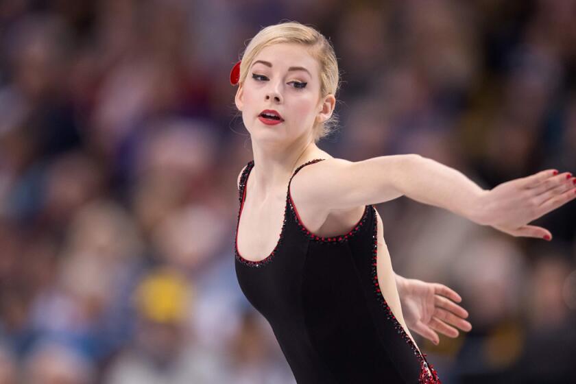 American Gracie Gold was in first place after the women's short program at the figure skating world championships in Boston on Thursday.