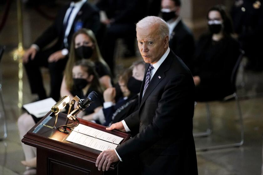 President Joe Biden speaks during a ceremony to honor slain U.S. Capitol Police officer William "Billy" Evans as he lies in honor at the Capitol in Washington, Tuesday, April 13, 2021. (Amr Alfiky/The New York Times via AP, Pool)