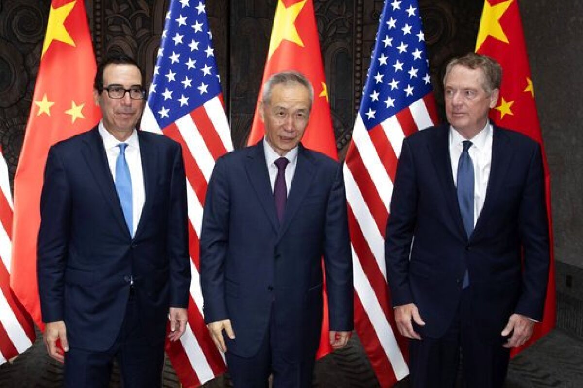Chinese Vice Premier Liu He, center, with Treasury Secretary Steven T. Mnuchin, left, and U.S. Trade Representative Robert Lighthizer at the Xijiao Conference Center in Shanghai on July 31.