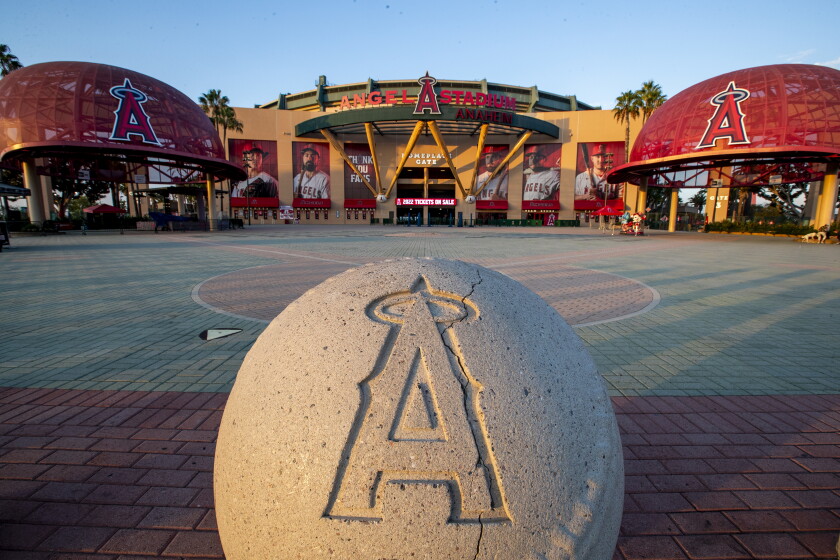 A baseball statue with the Angels logo outside Angel Stadium.