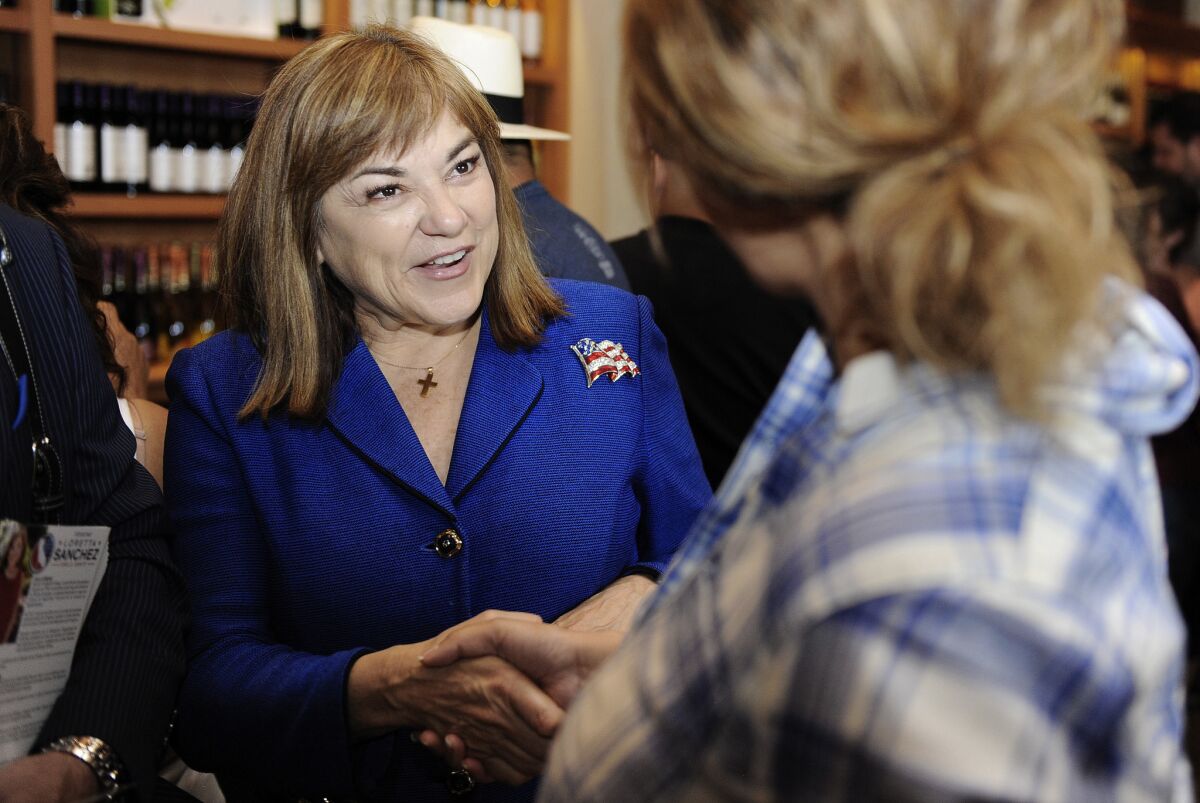 U.S. Senate candidate Loretta Sanchez talks with potential voters at San Antonio Winery on Sunday.