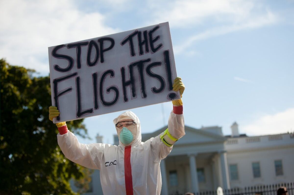 A man dressed in a Hazmat costume protests the entry of Ebola into the United States from Africa at the White House earlier this month.
