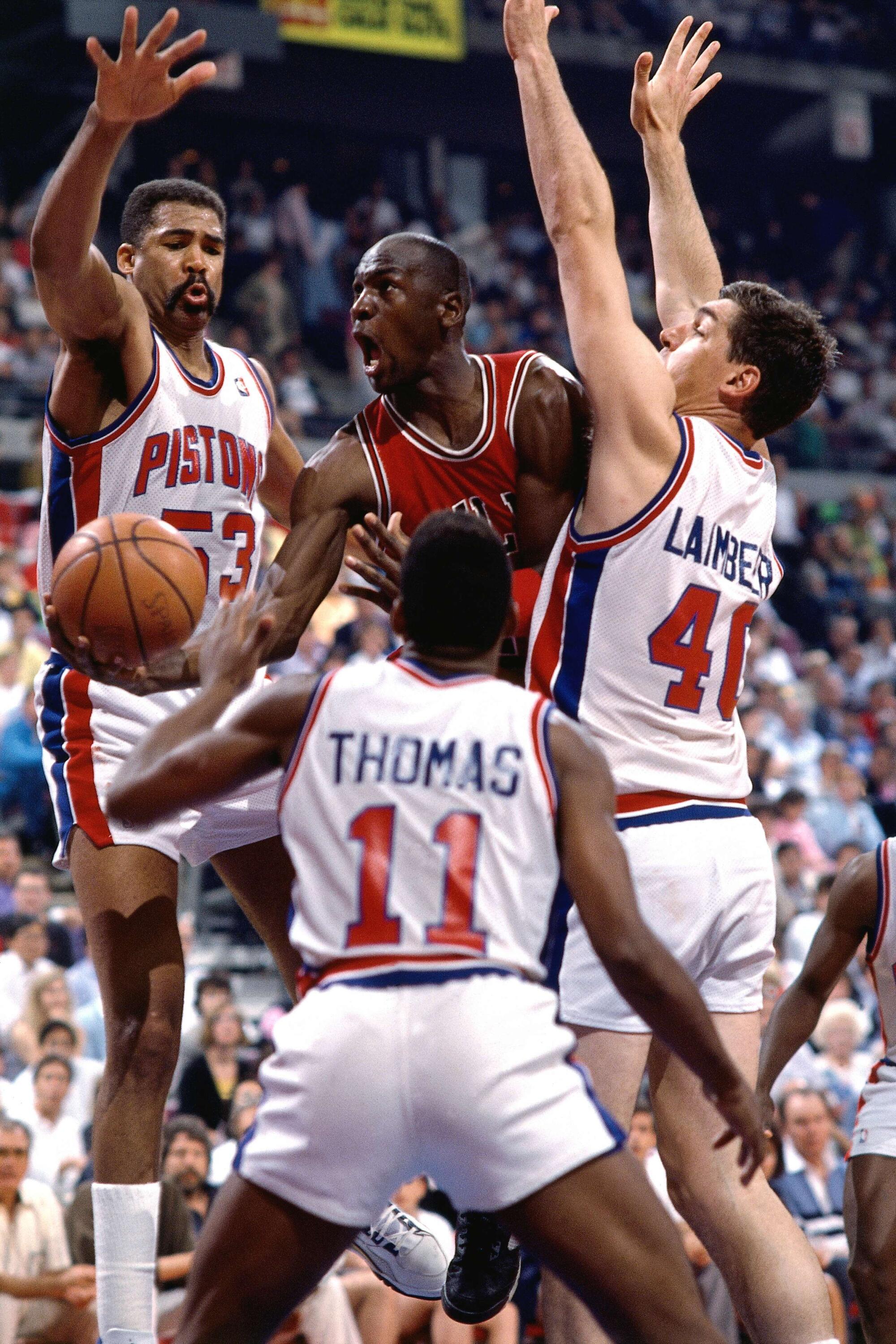 Michael Jordan #23 of the Chicago Bulls drives to basket against the Detroit Pistons during 1989 season NBA game