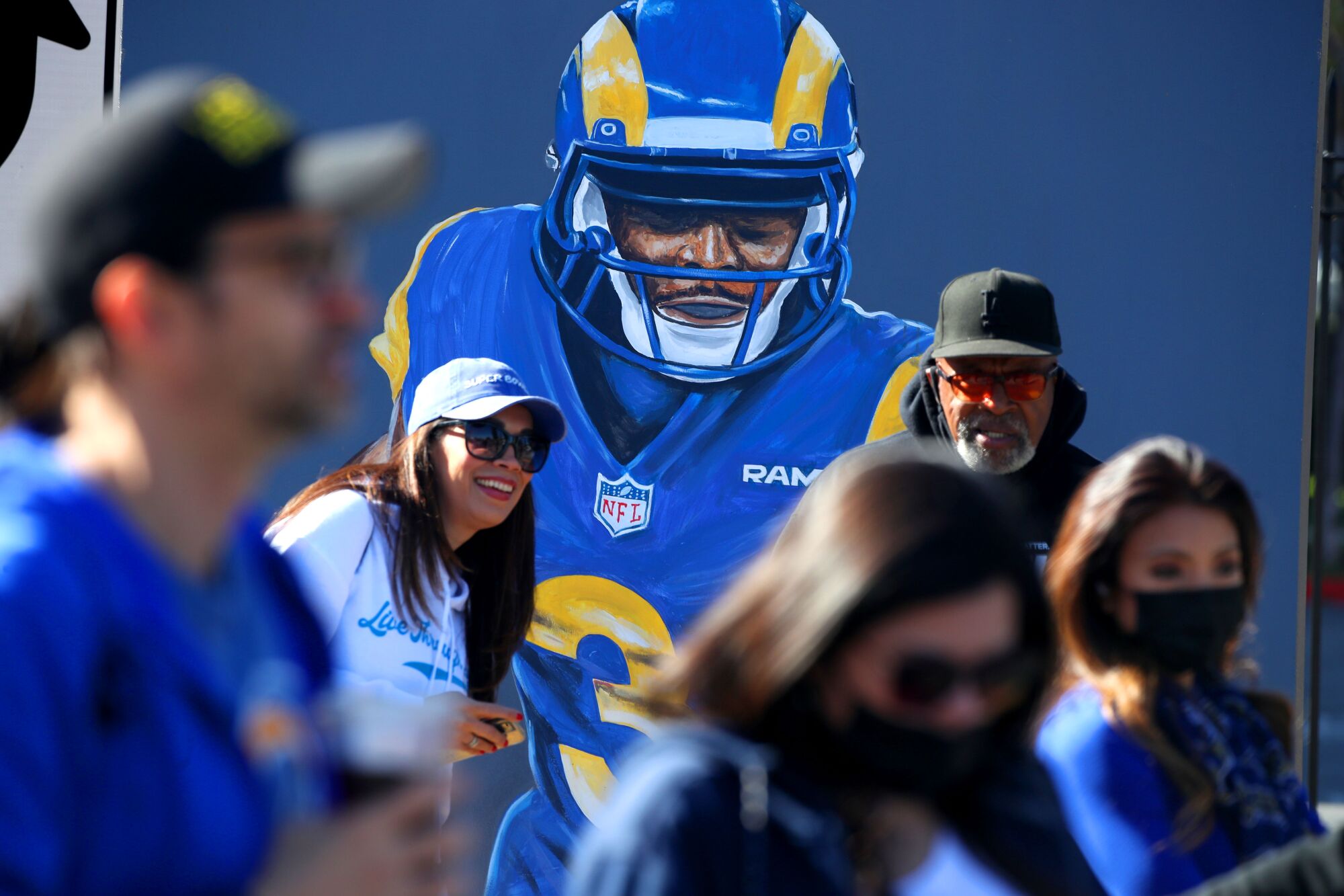 Fans gather in Exposition Park hours before the Rams' victory parade and celebration.