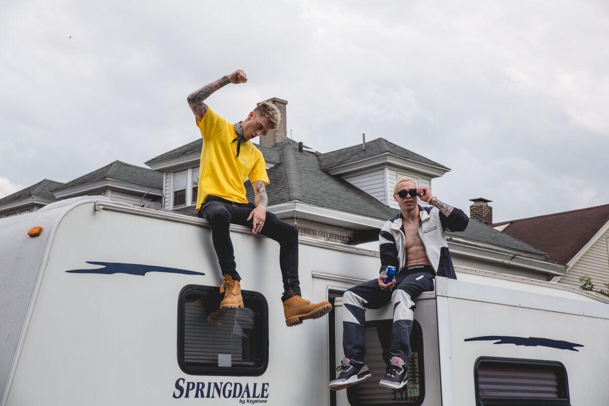 Machine Gun Kelly and Pete Davidson atop an RV in the movie 'Big Time Adolescence'