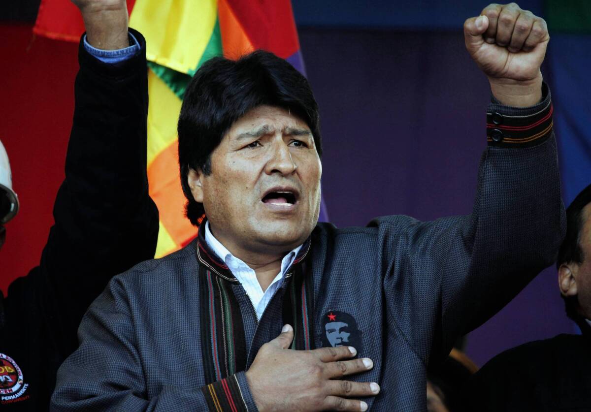 Former Bolivian President Evo Morales sings the national anthem in a file photo.