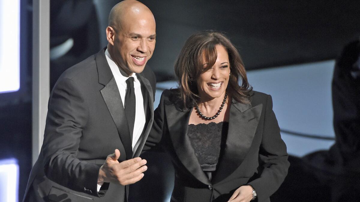 Sens. Cory Booker and Kamala Harris speak Saturday at the NAACP Image Awards at the Dolby Theatre in Los Angeles.