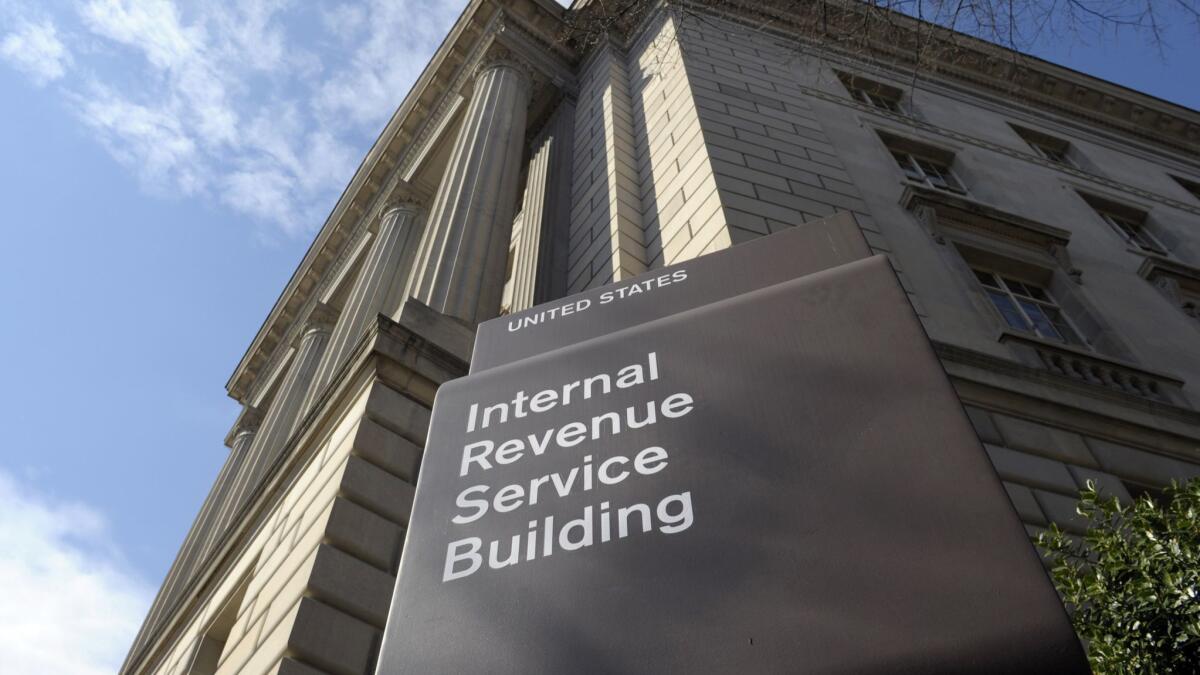A sign reads "the Internal Revenue Service Building."