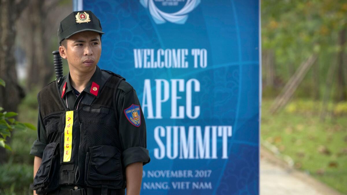 A security guard stands outside the venue for the Asia-Pacific Economic Cooperation group summit in Da Nang, Vietnam.