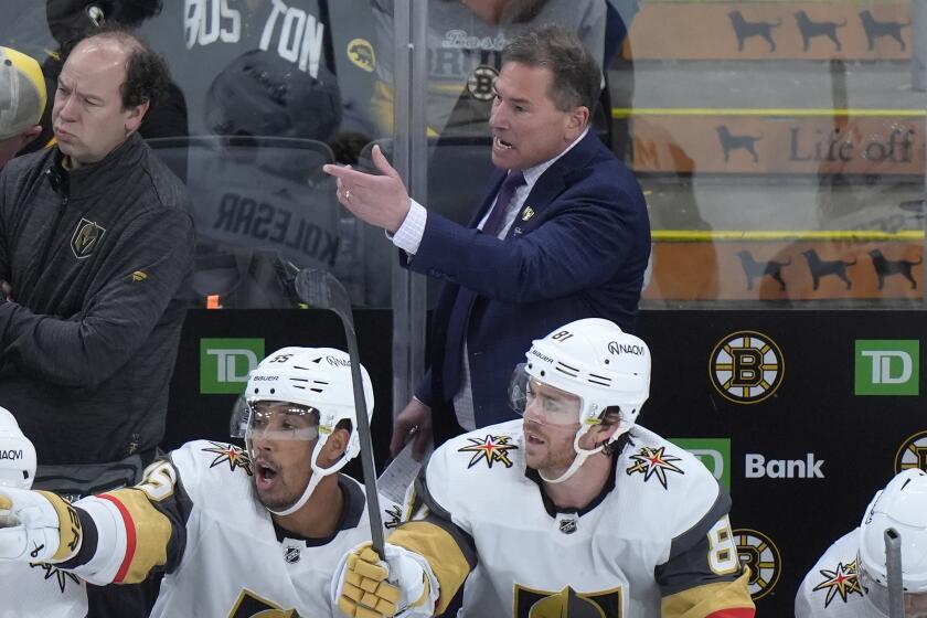 Vegas Golden Knights head coach Bruce Cassidy, top right, shouts from behind the bench in the second period of an NHL hockey game against the Boston Bruins, Thursday, Feb. 29, 2024, in Boston. (AP Photo/Steven Senne)