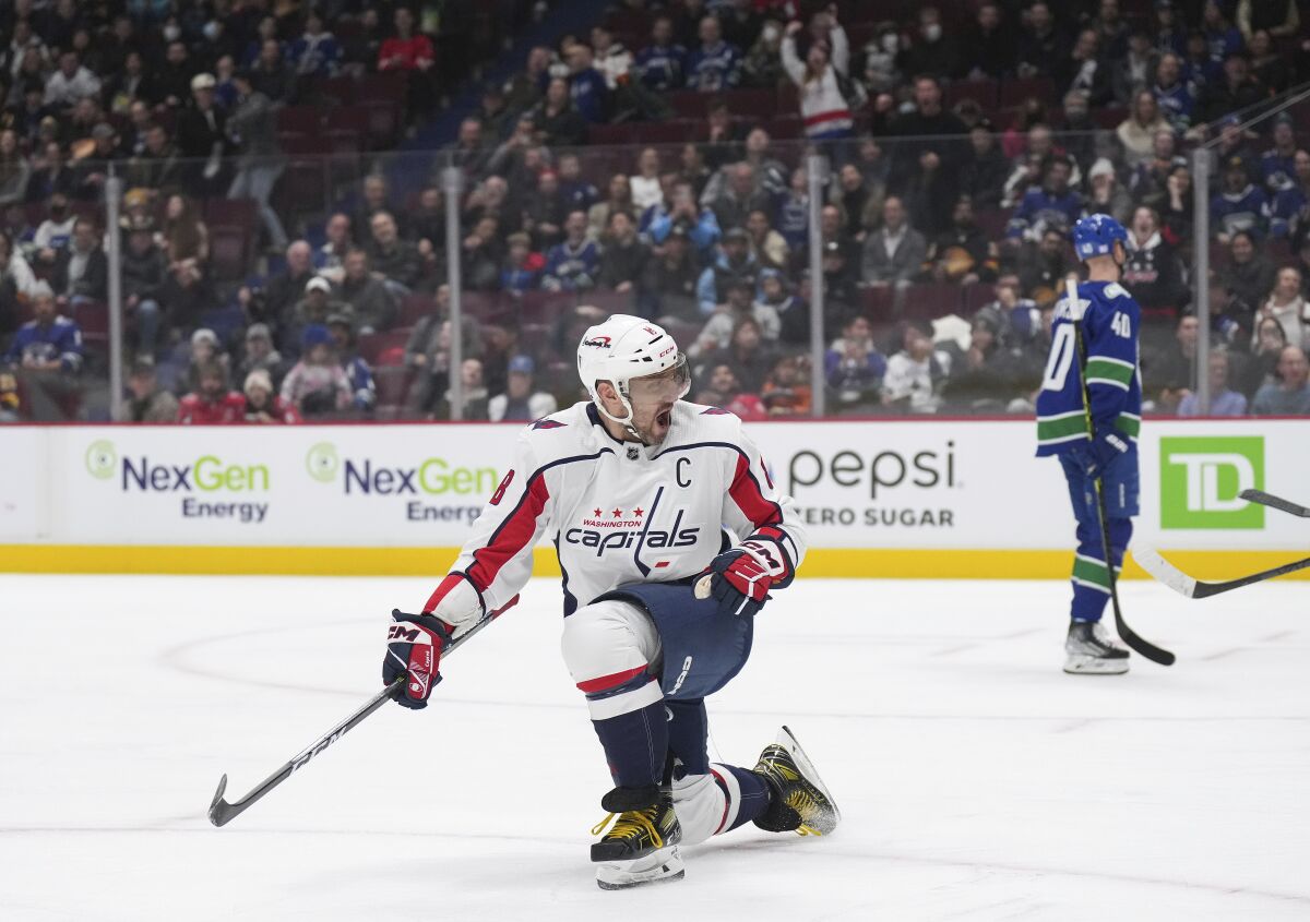 Washington Capitals' Alex Ovechkin celebrates a goal against the Vancouver Canucks during the first period of an NHL hockey game Tuesday, Nov. 29, 2022, in Vancouver, British Columbia. (Darryl Dyck/The Canadian Press via AP)