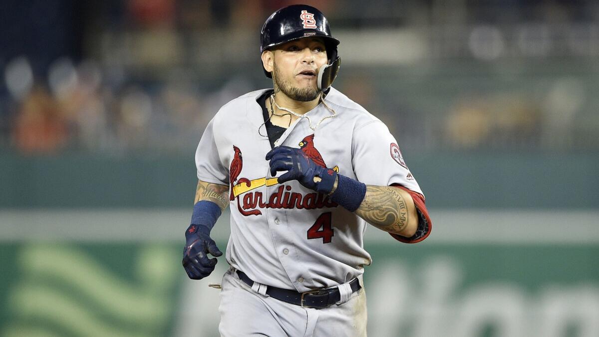 St. Louis Cardinals' Yadier Molina rounds the bases after his grand slam against the Washington Nationals.