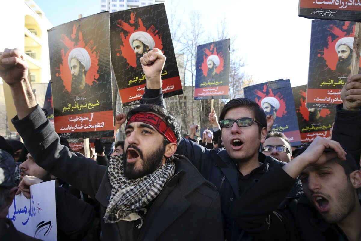 Iranian demonstrators in Tehran on Sunday chant slogans during a protest denouncing Saudi Arabia's execution of Sheik Nimr al-Nimr, a prominent opposition Shiite Muslim cleric.