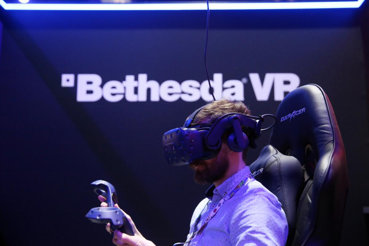 Scott Hayden interacts at the Bethesda VR experience.